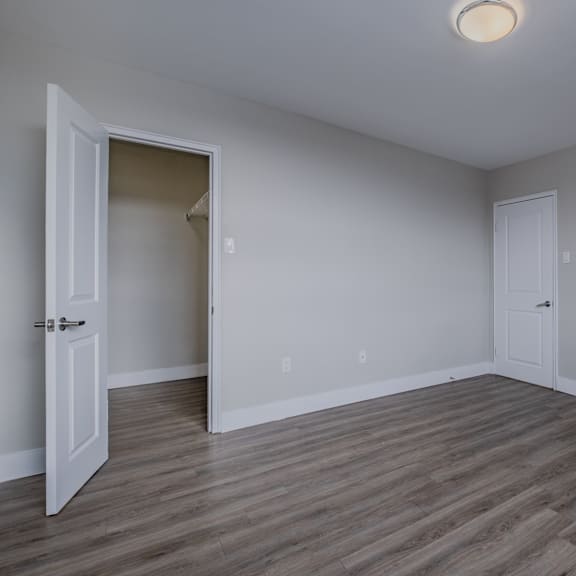a room with a white door and a white wall.