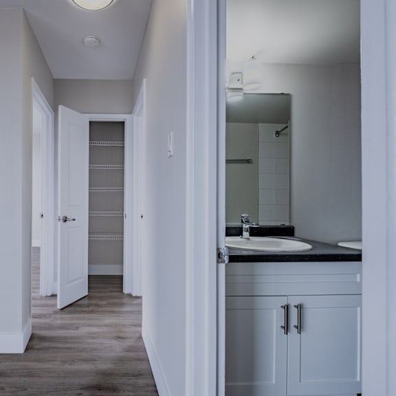 a bathroom with a sink and mirror.
