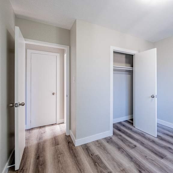 a room with a white door and a white wall.