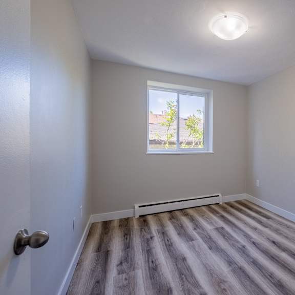 a room with a window and a door.