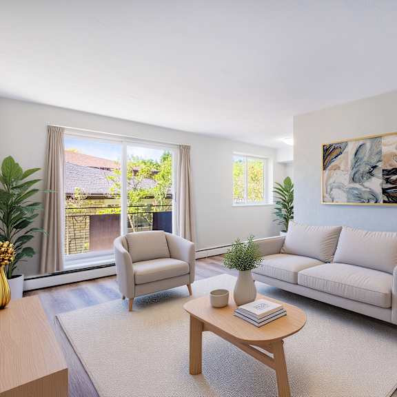 a living room with a couch, chair, and coffee table.
