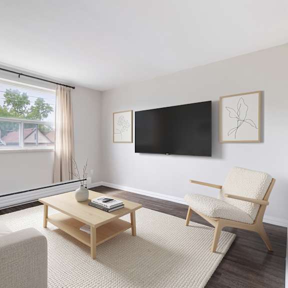 a living room with a couch, chair, and television.