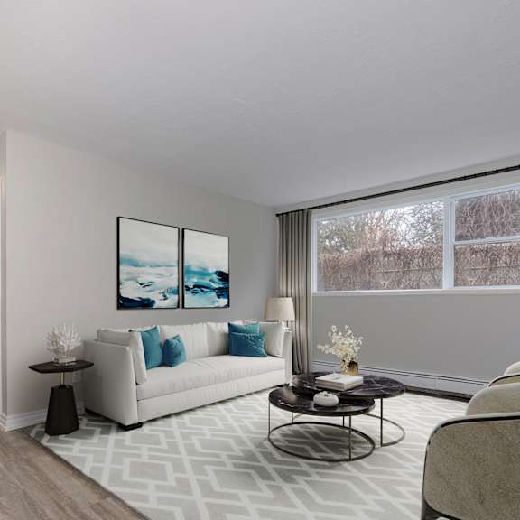 a living room with a white sofa and a coffee table.