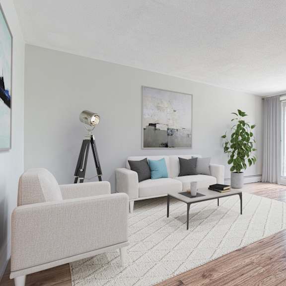 a living room with a white sofa, a white chair, a coffee table, and a painting on the wall.