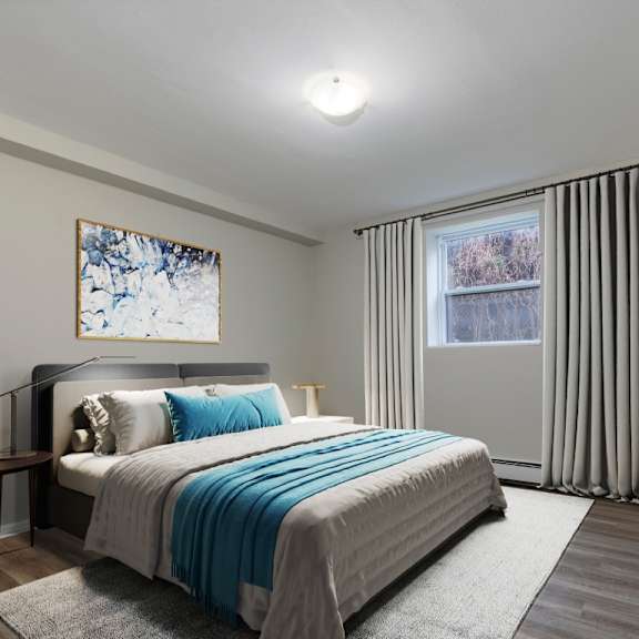 a bedroom with a large bed and a painting on the wall.