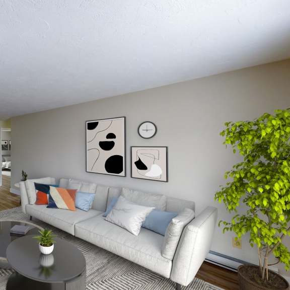 a living room with a white couch and a television.