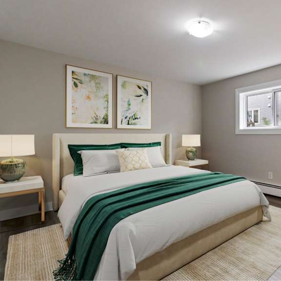 a bedroom with a large bed and two lamps.