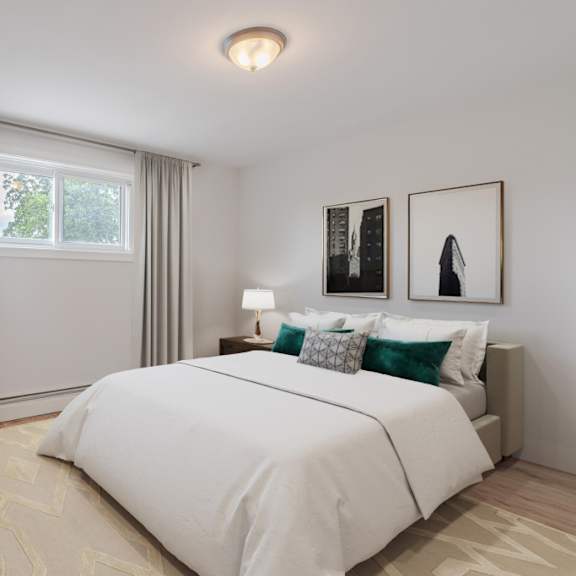 a bedroom with a large bed and a window with curtains.