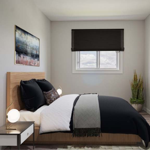 a bedroom with a bed, nightstand, and two framed pictures on the wall.