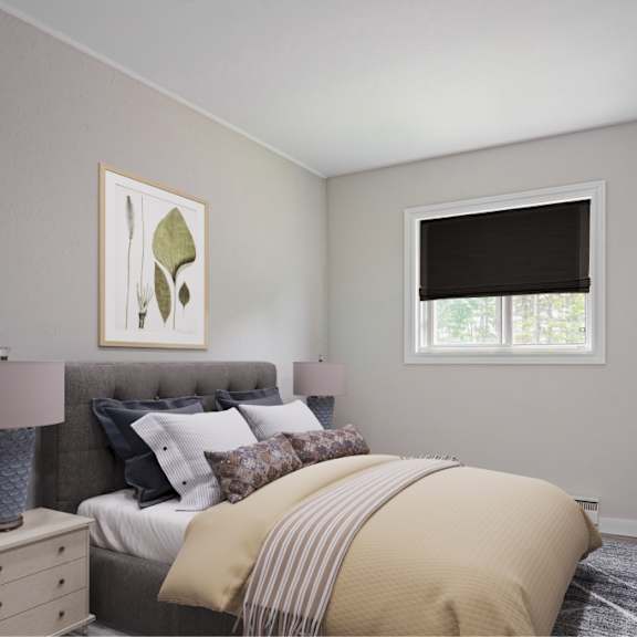 a bedroom with a bed, nightstand, and a painting on the wall.