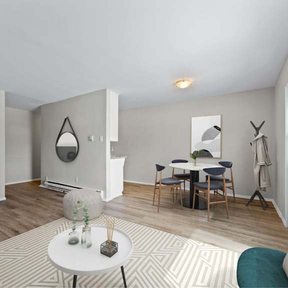 a living room with a white coffee table and a grey sofa.