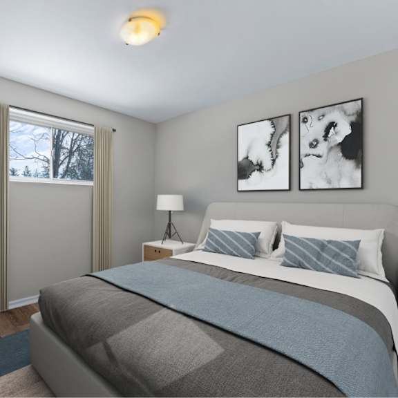 a bedroom with a large bed and two pictures on the wall.