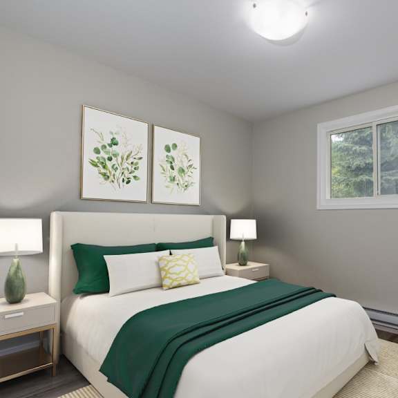 a bedroom with a large bed and a window showing trees outside.