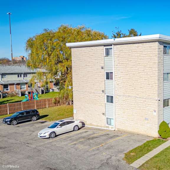 a building with a parking lot in front of it.