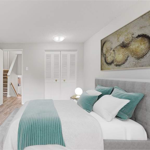 a bedroom with a bed, a dresser, a mirror, and a painting on the wall.