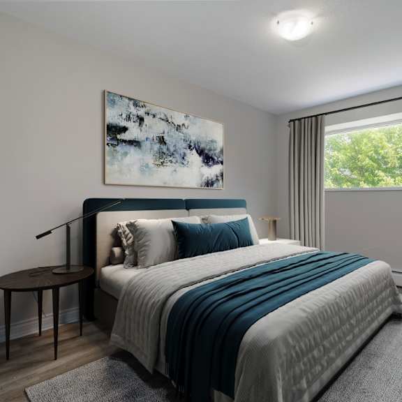 a bedroom with a large bed and a painting on the wall.