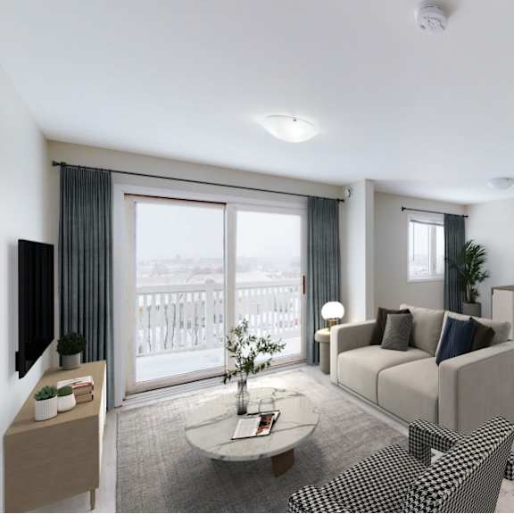 a living room with a couch, chairs, and a coffee table.