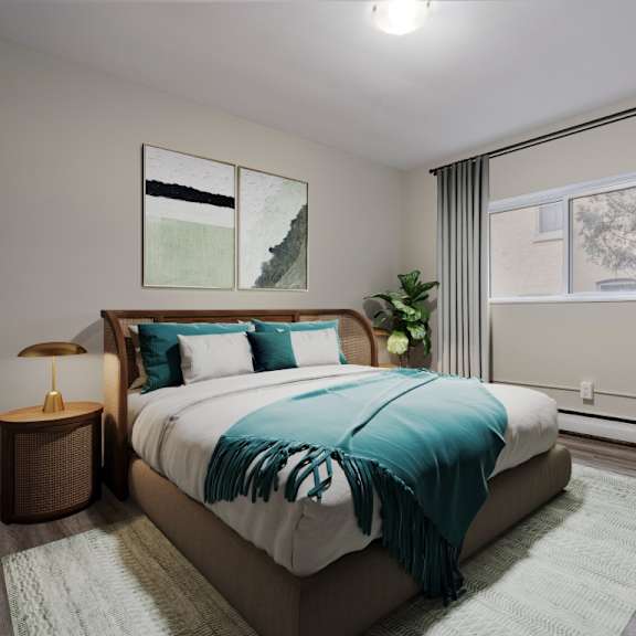 a bedroom with a large bed and a lamp on a side table.