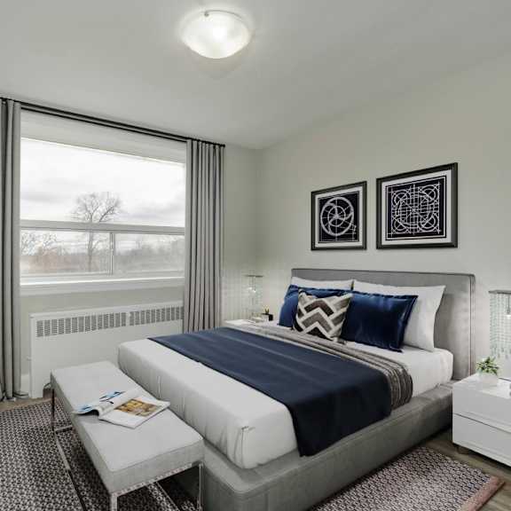 a bedroom with a large bed and a window with curtains.