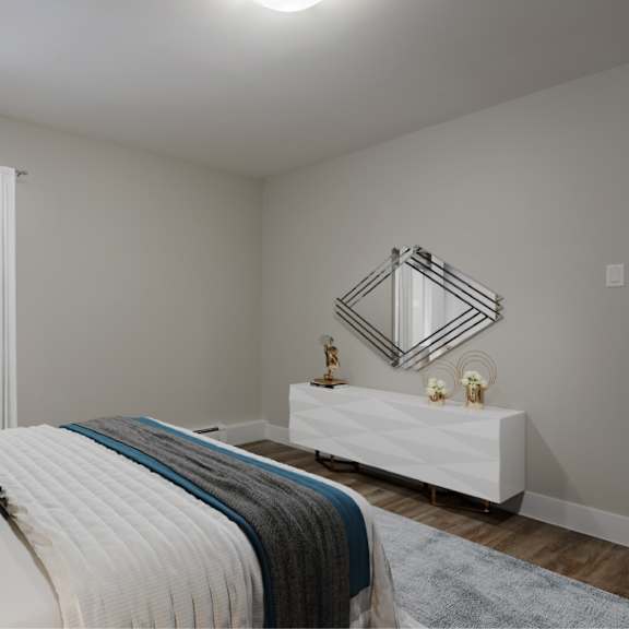 a bedroom with a large bed and a white dresser.