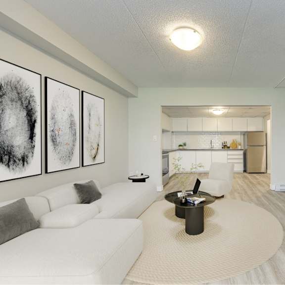 a living room with a white couch and a coffee table.