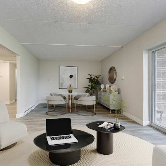 a modern living room with a white chair, a black coffee table, and a piano.