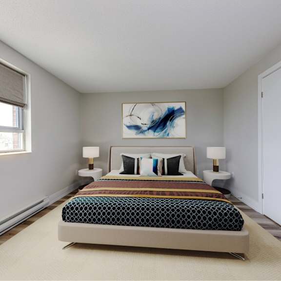 a bedroom with a bed, two lamps, and a painting on the wall.