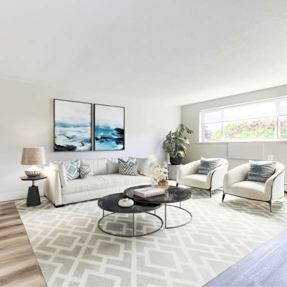 a living room with a television, a couch, and a coffee table.
