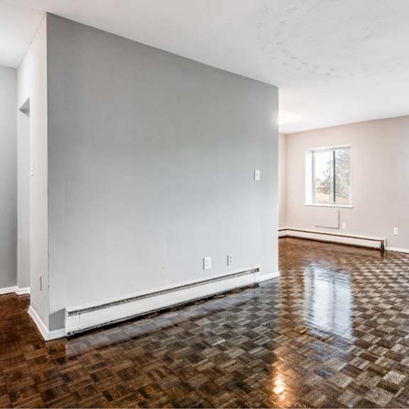 a room with a tiled floor and a sliding glass door.