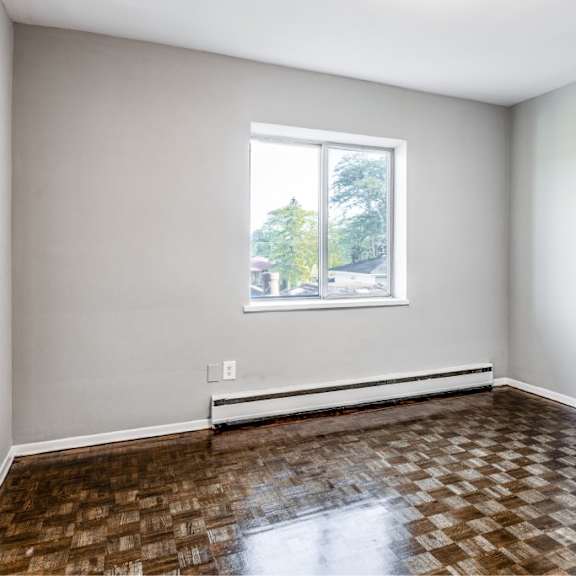 a room with a checkered floor and a window.