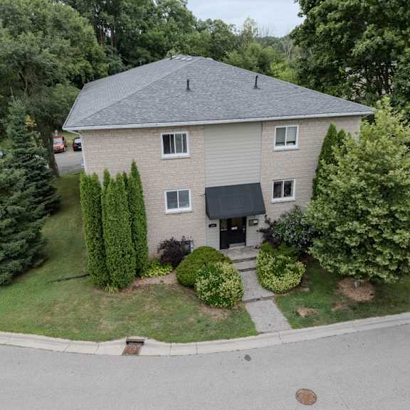 a house with a grey roof and a grey front door.