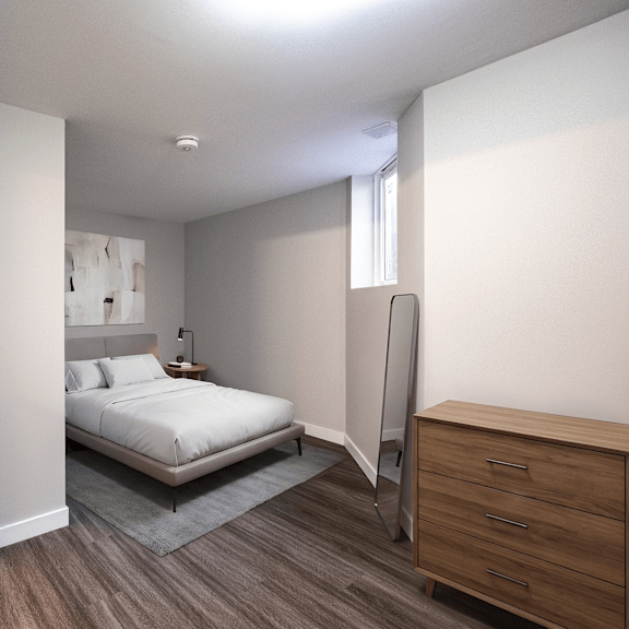a bedroom with a bed, nightstand, and wardrobe.