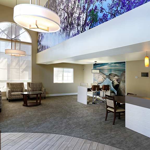 a spacious waiting room with a large mural on the wall.