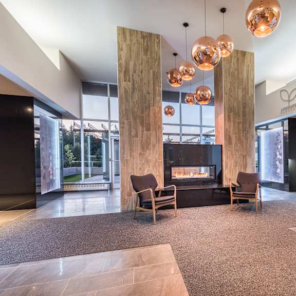 a lobby with a reception desk and a sign that says albro.