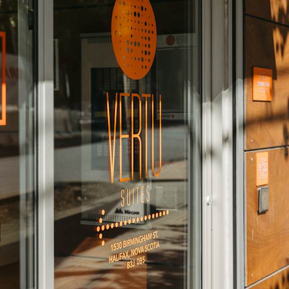 a glass door with a sign that says verb on it.