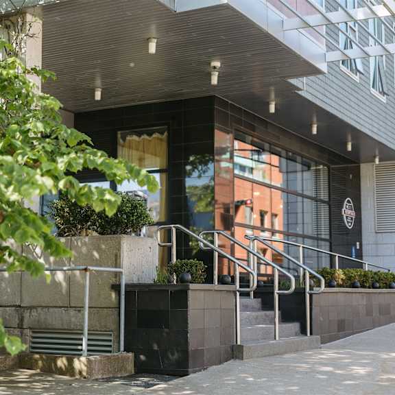 a building with a black and white logo on the wall.
