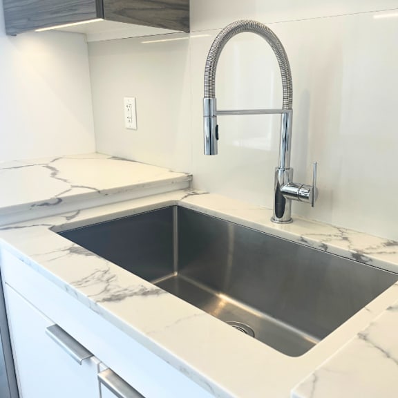 a kitchen with a sink and a faucet.