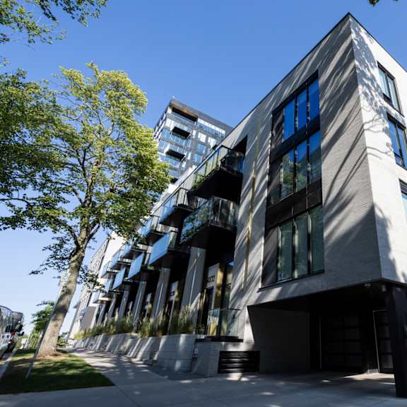 a modern building with a combination of white and dark grey exterior.