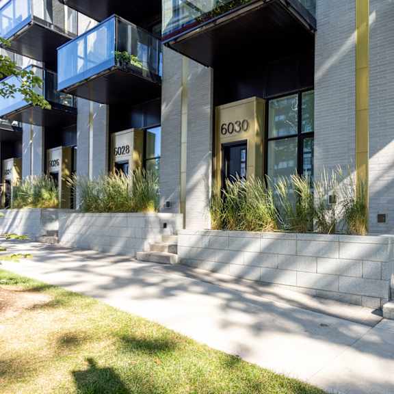 a modern building with the number 6032 on the front door.