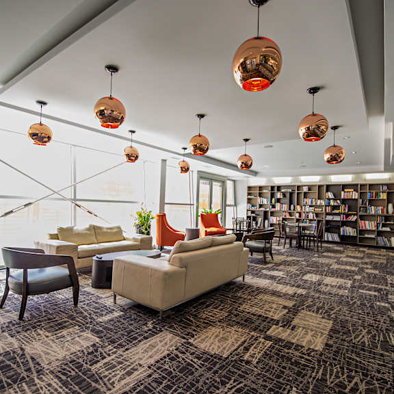 a room with a lot of furniture and a glass wall.