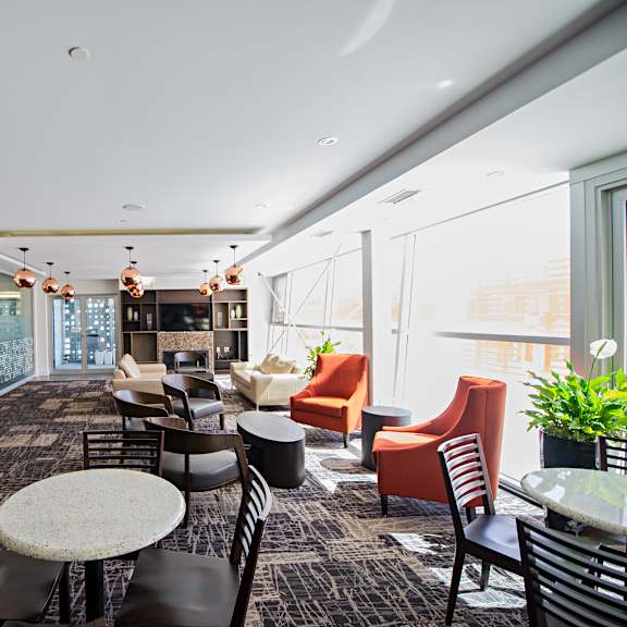 a modern office lounge with a variety of seating options.