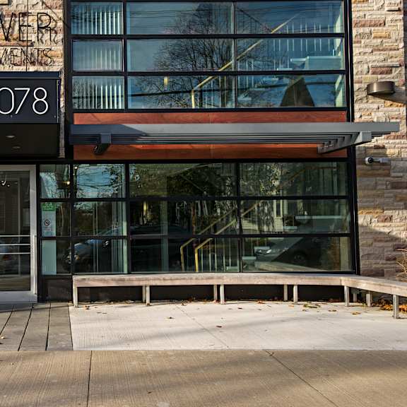 a building with a glass door and a sign that reads "tower".