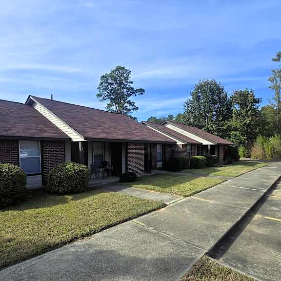 a row of houses with a clear blue sky above.