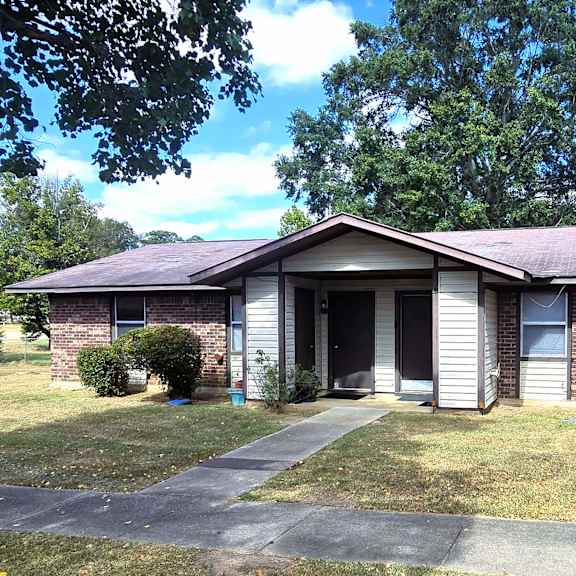 a house with a grey roof and a grey garage door.