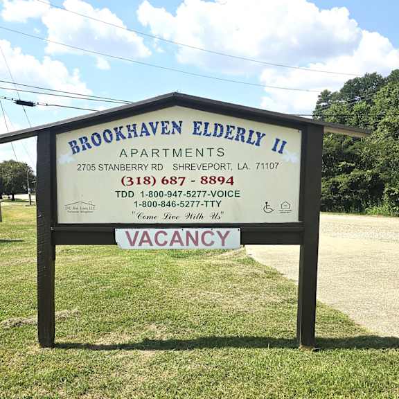 a sign for brookhaven elderly ii apartments with a vacancy notice.