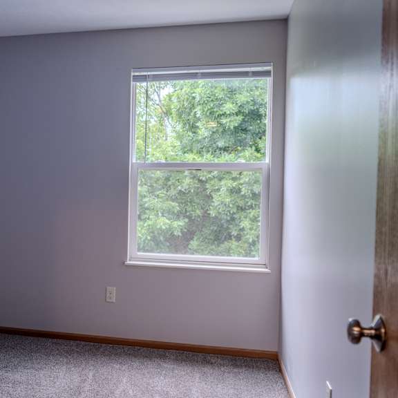 a room with a window and a door.