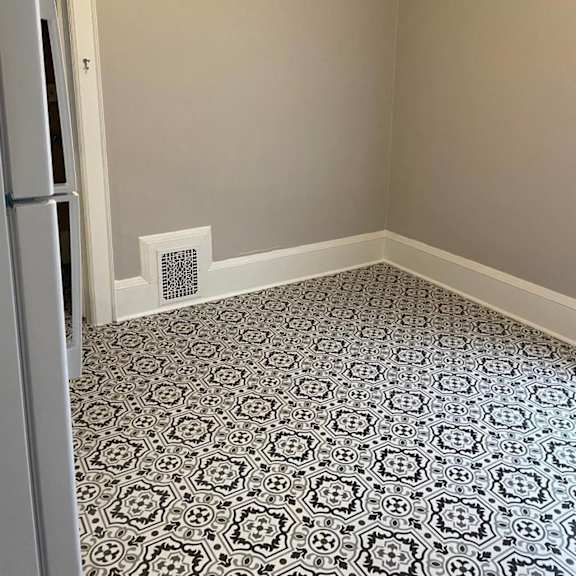 a room with a black and white patterned floor.