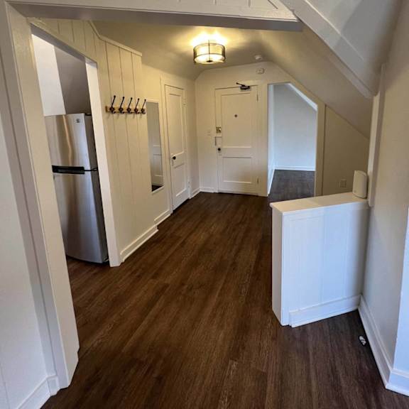 a kitchen with a refrigerator and a cabinet.