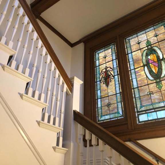 stained glass windows on a staircase.