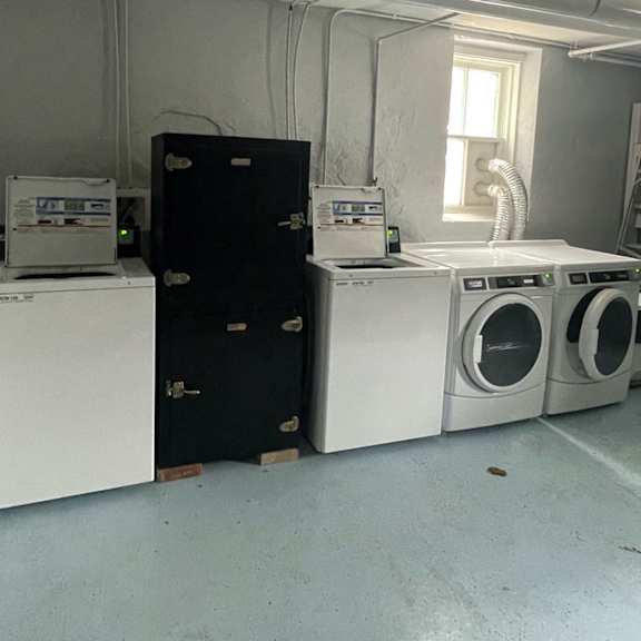 a laundry room with a washer and dryer.
